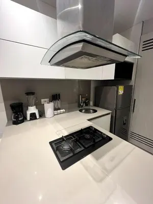 a kitchen with a stove top oven in a kitchen at Apto 305 Distrito 90 in Barranquilla