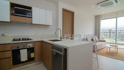 a kitchen with a sink and a counter top at New And Luxury Apartment 3BR In Baia Kristal in Los Arrayanes