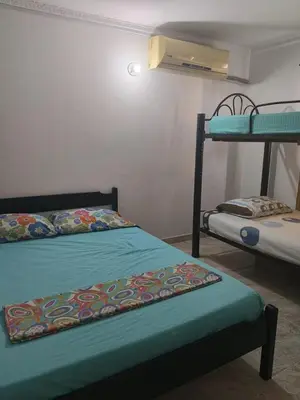 a room with two bunk beds in a room at Apartamento Villa Saika in Coveñas