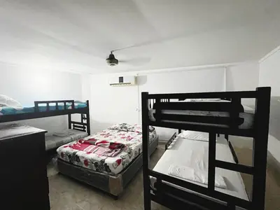 a room with two bunk beds in a room at Apartamento Villa Saika in Coveñas