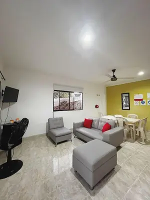 a living room with a couch and a table at Apartamento Villa Saika in Coveñas