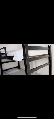a view of a bunk bed with a ladder at Cabaña Eterno Nirvana in Santa Veronica