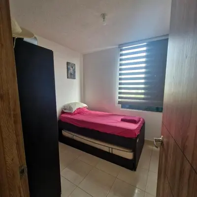 a small bed in a room with a window at Apartmento en Parque Heredia in Cartagena de Indias