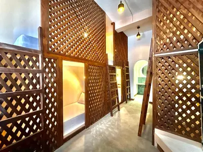 a room with a wooden wall with wooden doors at Masaya Cartagena in Cartagena de Indias
