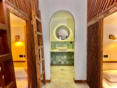 a bathroom with a mirror and a sink in a room at Masaya Cartagena in Cartagena de Indias