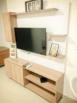 a flat screen tv on a wall in a living room at Lofts Mediterraneo in Barranquilla