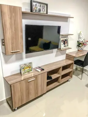 a living room with a large flat screen tv on a wall at Lofts Mediterraneo in Barranquilla