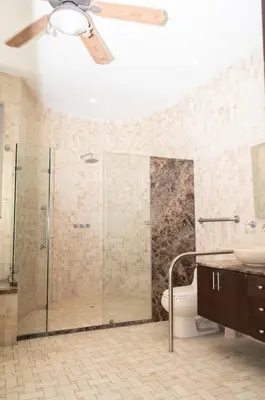 a bathroom with a shower and a ceiling fan at Villa exclusiva junto al mar en Cartagena in Cartagena de Indias