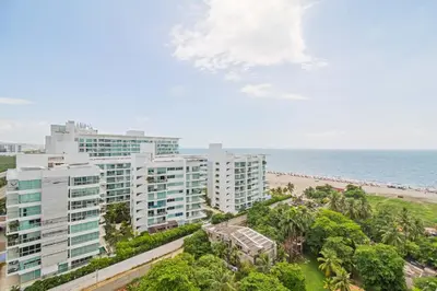 an aerial view of a building next to the beach at Sonesta Resort Apartamento Morros Cartagena in Cartagena de Indias