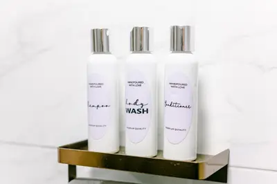 a group of three white bottles on a shelf at Sublime Hotel Cartagena in Cartagena de Indias