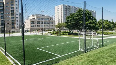 a soccer field with a net in a city at Apartamentos Palmar - Excelente Ubicación by SOHO in Barranquilla