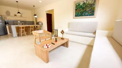 a living room with a couch and a coffee table at Cabaña Tierramia 2 in San Silvestre