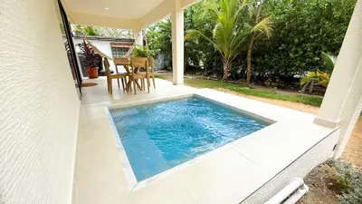 a swimming pool on the patio of a house at Cabaña Tierramia 2 in San Silvestre