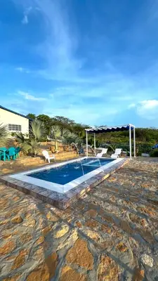 a swimming pool with a canopy at Liz&Mar in El Morro