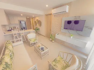 an overhead view of a living room with a couch and chairs at Apart Suítes Stay Morros EOS - Acceso directo a la playa in Cartagena de Indias
