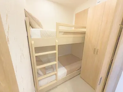 a small room with two bunk beds in it at Apart Suítes Stay Morros EOS - Acceso directo a la playa in Cartagena de Indias