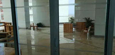 a glass door of a room with a table and chairs at Palmetto Eliptic Bahia in Cartagena de Indias