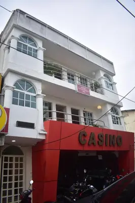 a building with motorcycles parked in front of it at Hotel San Francisco Inn in Barranquilla