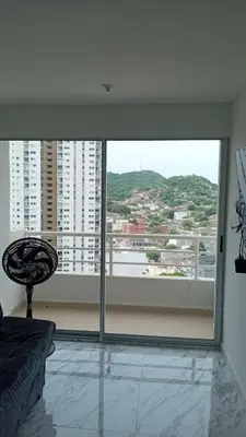 a room with a large window with a view of a city at Edificio Lotus Torices Cartagena in Cartagena de Indias