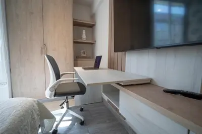 a room with a desk with a laptop and a chair at Refugio costero, Serena del Mar - Cartagena Indias in Serena del Mar