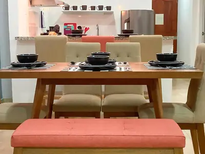 a wooden table with bowls and plates on it at Vive 801 in Cartagena de Indias