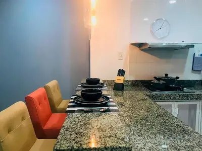 a kitchen with a table with dishes on it at Vive 801 in Cartagena de Indias