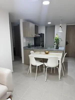 a kitchen and dining room with a table and chairs at Baluarte de caribe 212 in Cartagena de Indias