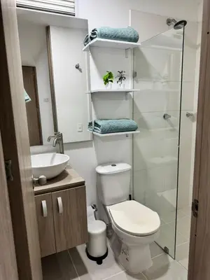 a bathroom with a toilet and a sink at Baluarte de caribe 212 in Cartagena de Indias