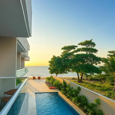 a balcony with a swimming pool and the ocean at Stanza Del Mar in Coveñas