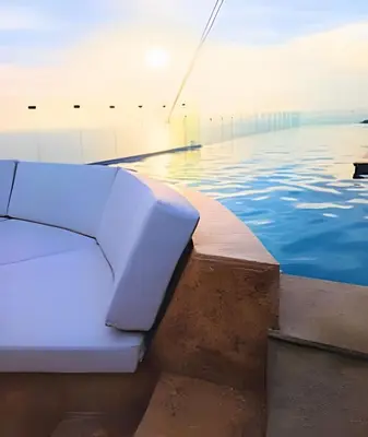 a pool with blue water and a swimming pool at Spectacular apartment, unparallel views! in Cartagena de Indias
