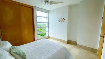 a bedroom with a bed and a window at Magico Apartamento Frente al Mar 3 Habitaciones TR72 in Coveñas