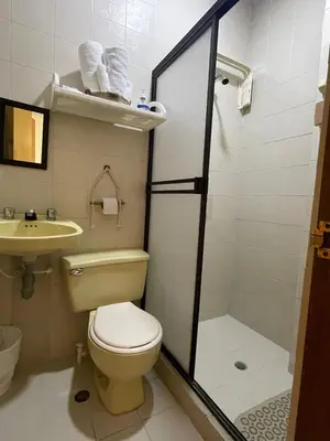 a bathroom with a toilet and a sink at Casa Inés Tolú in Tolú