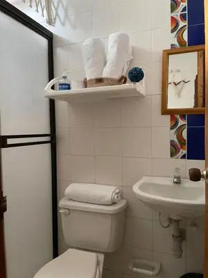 a bathroom with a toilet and a sink at Casa Inés Tolú in Tolú