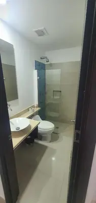 a bathroom with a toilet and a sink and a shower at Lodging Apto 37 Palmetto Eliptic in Cartagena de Indias