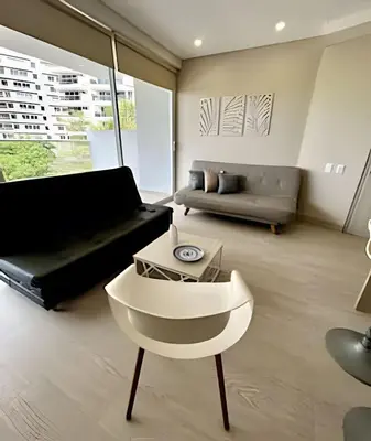 a living room with a couch and a table at Fantástico apartamento 505 in Cartagena de Indias