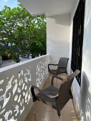 two chairs sitting on the balcony of a house at Acogedor apartamento excelente ubicación in Barranquilla