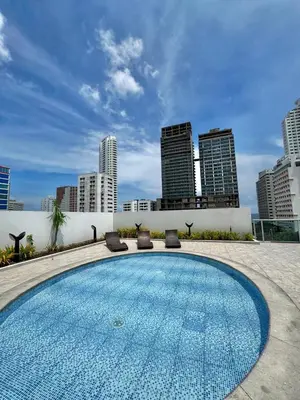 a swimming pool with a city skyline in the background at Apartamento con hermosa vista en Bocagrande in Cartagena de Indias