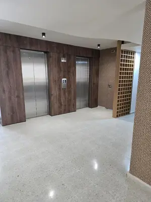 an empty room with elevators in a building at brisa y sol - sunset 47 in Cartagena de Indias