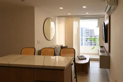 a living room with a couch and a mirror at Torre 811 By Jalo in Cartagena de Indias