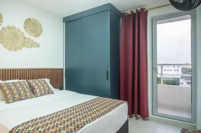 a bedroom with a bed and a large window at Torre 811 By Jalo in Cartagena de Indias