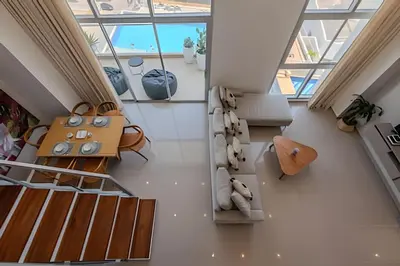 a living room with a couch and a table at Doble altura y lujoso apto vista al mar in Cartagena de Indias