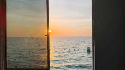 a view of the ocean from a window at Renacer ancestral Barú in Playa Blanca