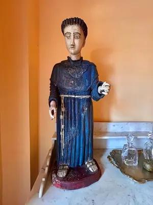 a statue of a man standing on a table at Apto cuesta 203 in Cartagena de Indias