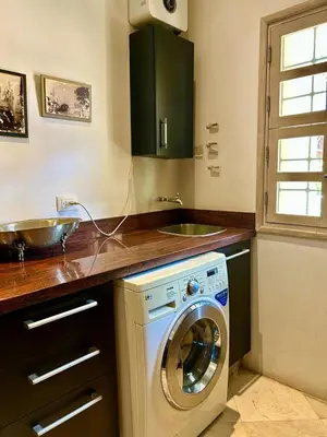 a kitchen with a washing machine and a sink at Apto cuesta 203 in Cartagena de Indias