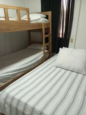 a bedroom with two bunk beds in a room at Cabaña el cielo in Lorica