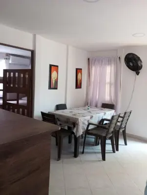 a dining room with a table and chairs at Cabaña el cielo in Lorica