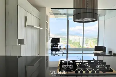 a kitchen with a stove and a dining room at Wai Blue/Luxury Beachfront/ Bello Horizonte/ TTO03 in Playa Dormida