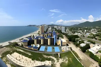 an aerial view of a resort next to the beach at Wai Blue/Luxury Beachfront/ Bello Horizonte/ TTO03 in Playa Dormida