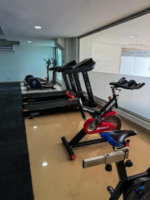 a gym with two exercise bikes in a room at Piso 30 vista al mar, Palmetto 1 Bocagrande in Cartagena de Indias