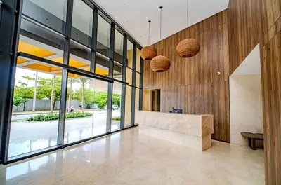 a lobby of a building with large glass windows at Modern Sunset Stay Cartagena in Cartagena de Indias